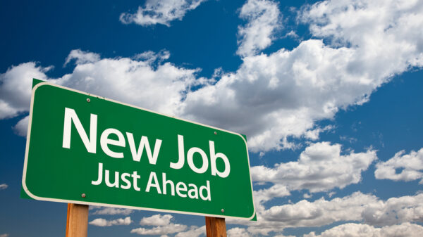green jobs on a road to net zero: New Job, Just Ahead Green Road Sign with Copy Room Over The Dramatic Clouds and Sky.