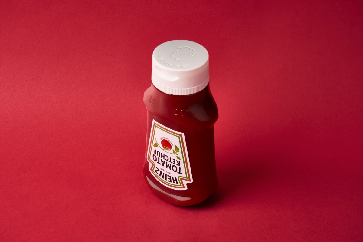 Recyclable heinz ketchup bottle on red background