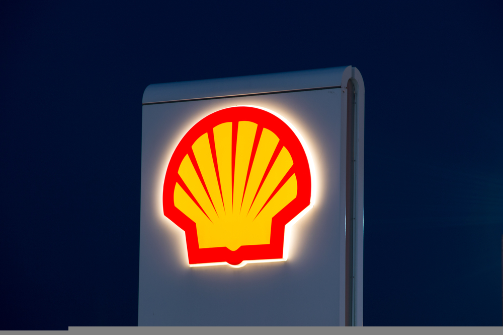Shell logo on petrol station at night.