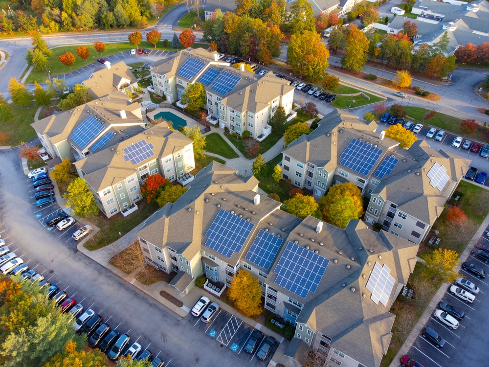 Solar panels on houses of a local community. The government has unveiled a £10 million Community Energy Fund to help communities develop local renewable projects.