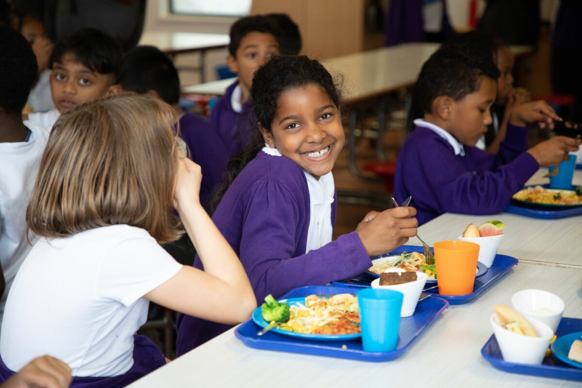 Student eating Chartwells sustainable food