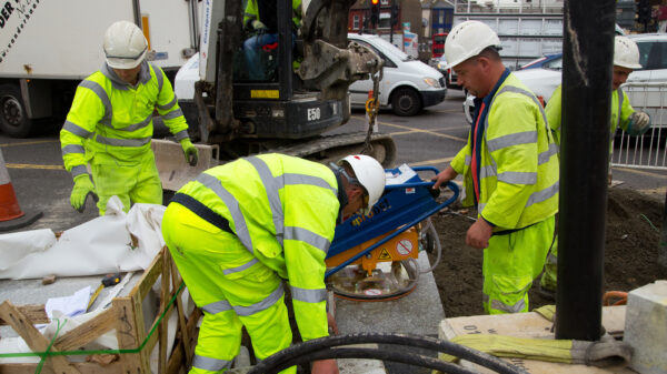 manufacturing workers: Unidentified workman using a sprobst vacuum stone magnet on October 15th, 2014 in London, England, UK. Sprobst is the leading european manufacturer of stone Handling Equipment.