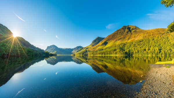 Morning panorama of Buttermere lake in the Lake District. England Santander UK has expanded its nature restoration partnerships with National Parks UK.