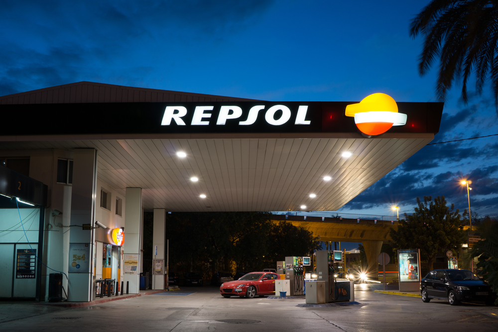 : A Repsol gas station at night.