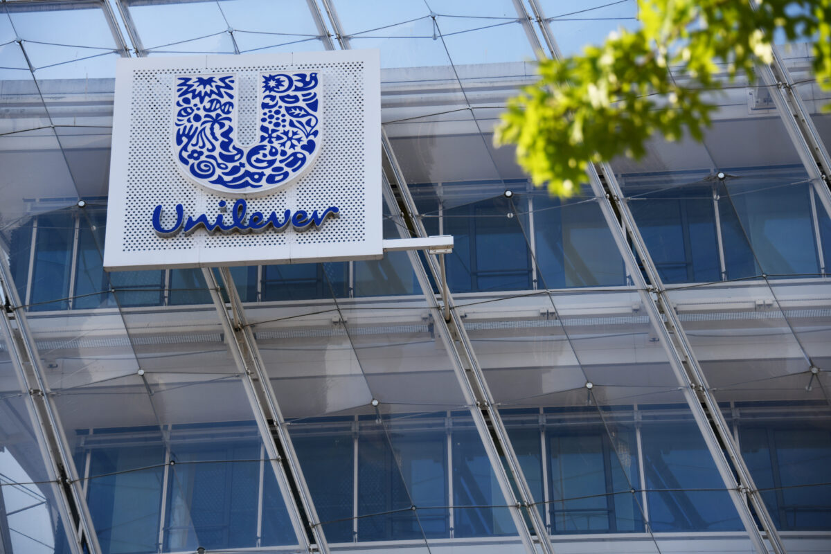 Unilever headquarters, with blue U logo on a glass building.