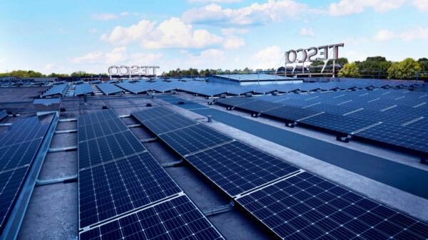 Solar panels above a Tesco store.Tesco plans to install solar panels on over 100 of its large stores across the UK within the next three years.