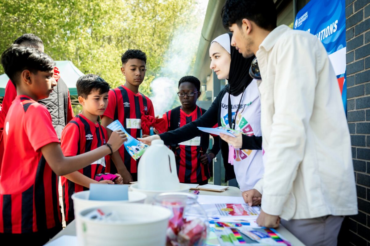 Nirvana Football Club players with De Monfort University UN volunteers