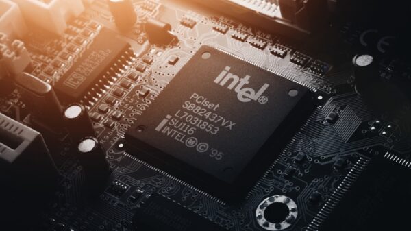 Intel computing chip on an old motherboard. Old electronics close-up. Chip ICS. Electronic background. Selective focus