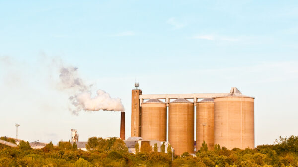 A factory emitting steam in the late afternoon sunlight in the UK. The government has awarded over £190 million to help industry transition to net zero by reducing emissions as it switches to cleaner energy. Top execs at Coca-Cola, Google, Unilever and Ikea have called on the EU to set an emissions reduction target of at least 90% by 2040.