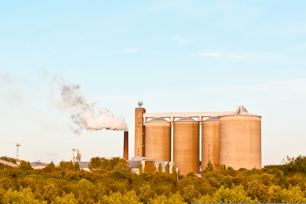 A factory emitting steam in the late afternoon sunlight in the UK. The government has awarded over £190 million to help industry transition to net zero by reducing emissions as it switches to cleaner energy. Top execs at Coca-Cola, Google, Unilever and Ikea have called on the EU to set an emissions reduction target of at least 90% by 2040.