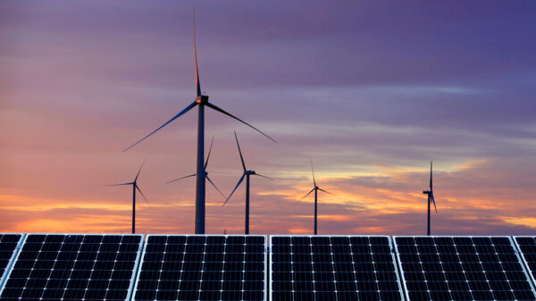 Solar photovoltaic panels and wind turbines. Renewable energy concept net zero