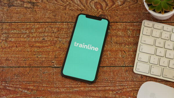 Trainline Iphone Display with Keyboard Mouse and Succulent. Trainline is an independent digital rail and coach ticketing platform.