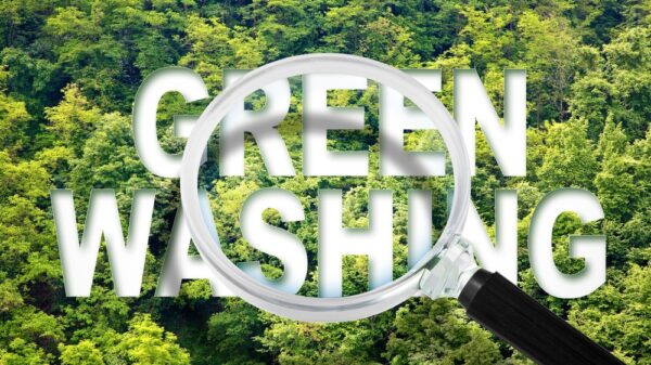 Greenwashing - concept with text against a forest and trees and magnifying glass. ASA chief executive Guy Parker has claimed that AI tools could help counteract the increased use of unverified climate buzzwords for products.