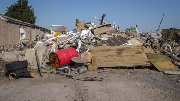 Mounds of demolition rubble and industrial waste at abandoned industrial site. The Environment agency has launched the Economic Crime Unit to tackle money laundering in the waste sector.
