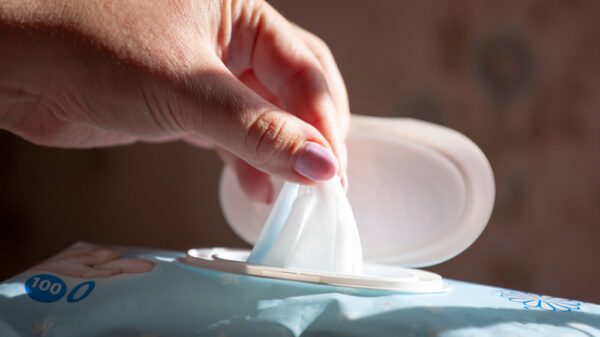 Hand picked a wet wipes in package box, Wet wipes in a woman's hand