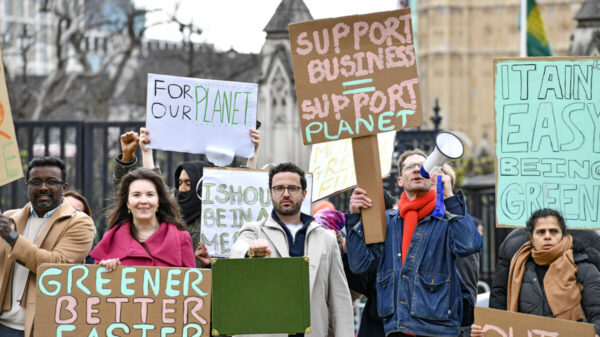 Climate campaigners delivered a red budget box to parliament, urging the government to support businesses in their sustainability efforts.